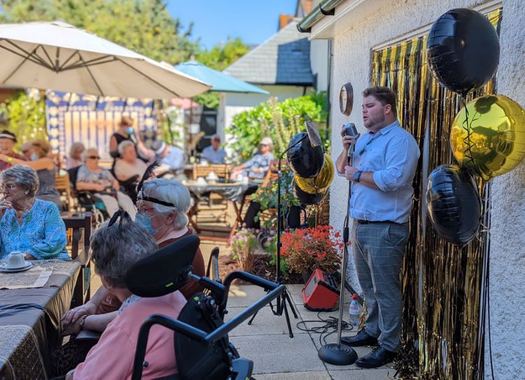Singer Wills Bailey-Hobbs provides the jazz soundtrack for the Afternoon Tea Week celebration at Colten Care’s Belmore Lodge in Lymington.  
