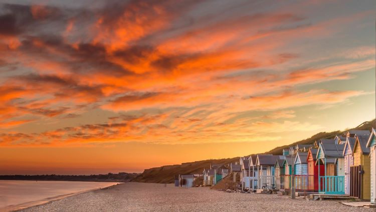 Hordle beach and beach huts at sunset