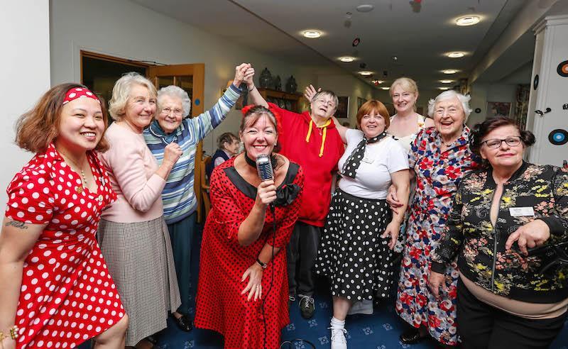 At the bop: Singer Retro Rita with guests at the charity supper at Colten Care’s Kingfishers care home in New Milton, Hampshire.