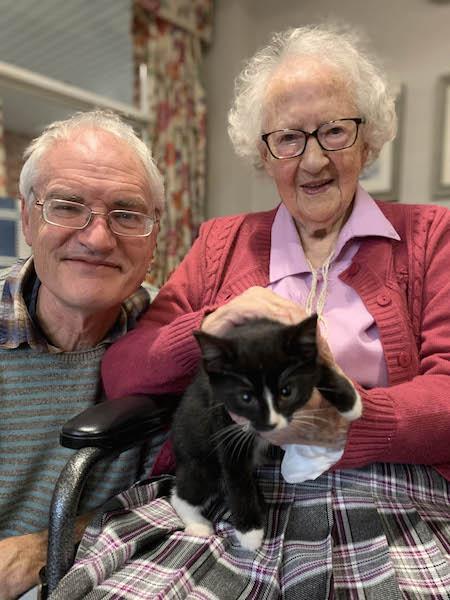 Court Lodge resident Doris Farrow, seen here with Jon Hancock, nicknamed one of rescued kittens ‘Socks’ because of its white paws.