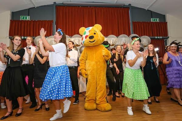 Colten Care residents and team members with Pudsey Bear at their Strictly Come Tea Dance in Lymington in aid of Children in Need.