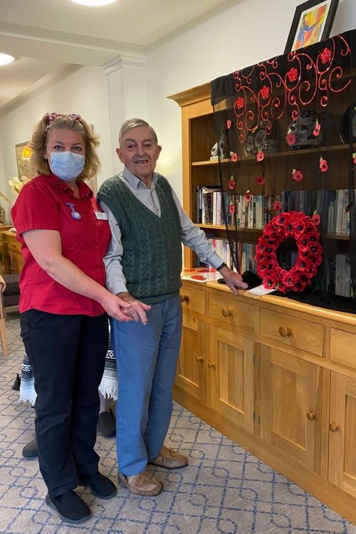 – Terry Vass, a resident at Colten Care’s Outstanding-rated Kingfishers in New Milton, was invited to lay the wreath at the home’s Remembrance service which took place in the residents’ lounge. Pictured with him is Companionship Team member Christina Holliday. 