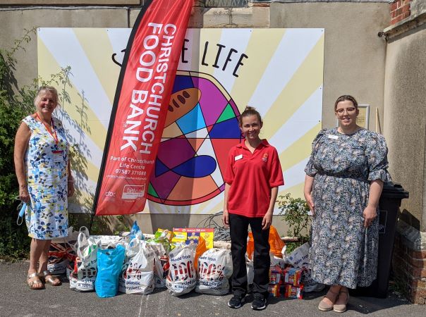 Colten Care helps hungry families by collecting donations for food bank