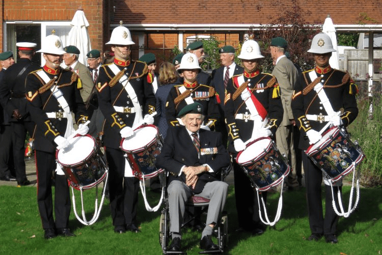 Ron Moyse with the Royal Marines bandsmen who performed for him on his 93rd birthday at Canford Chase care home in Poole. 