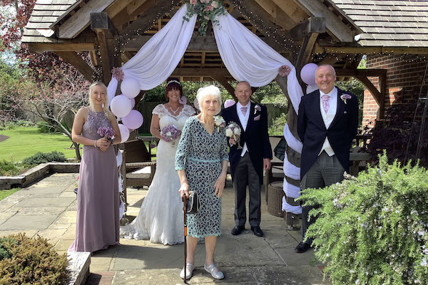 Proud mum Jean welcomes newlyweds to care home garden
