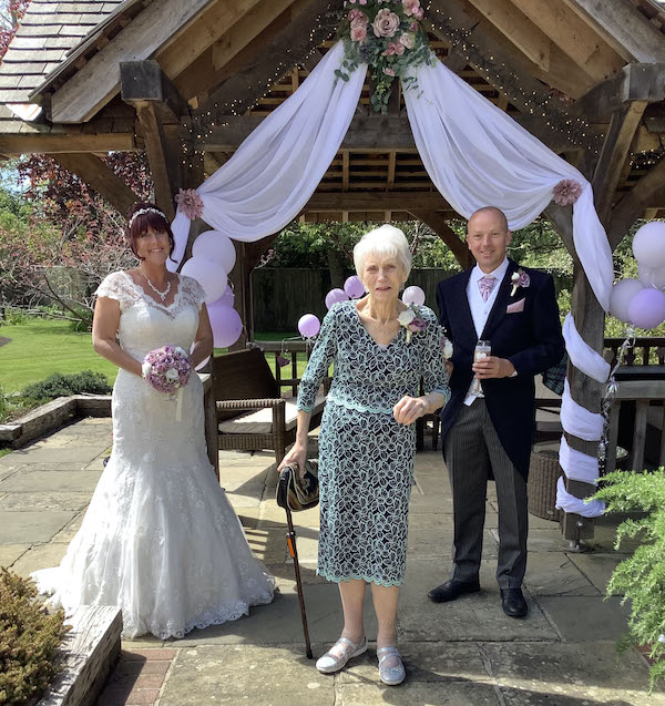 Jean Judd was delighted to welcome her son Stuart and new daughter-in-law Hannah to the garden of her care home, Colten Care’s Outstanding-rated Woodpeckers in Brockenhurst. Hannah also works for Colten Care as a chef at the Lymington care home Court Lodge.
