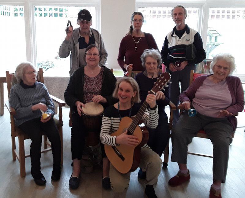 Music and Arts Partner Fiona Pritchard, front centre, with residents and relatives at The Aldbury dementia care home in Poole.