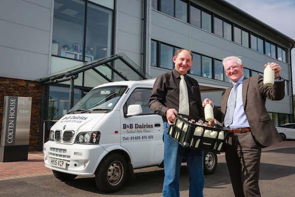 PINTA MILK. Nearby dairy business B&B Dairies now delivers fresh milk to Colten Care’s Ringwood head office in recyclable glass bottles. Milkman Ken Bolton, left, checks a delivery with Fergus Davitt, Colten Care’s Hotel Services Manager.