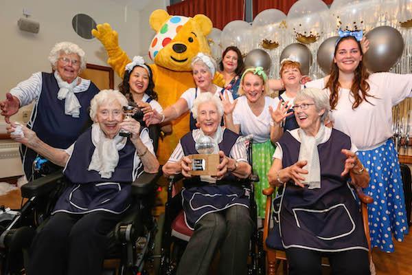 STRICTLY STARS. Colten Care residents and team members with Pudsey Bear at a Strictly Come Tea Dance in Lymington in autumn 2018 in aid of Children in Need.