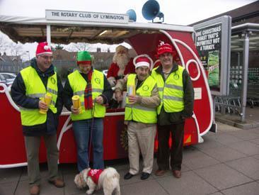 Father Christmas and his Rotary Elves with the Santa Sleigh in Lymington 