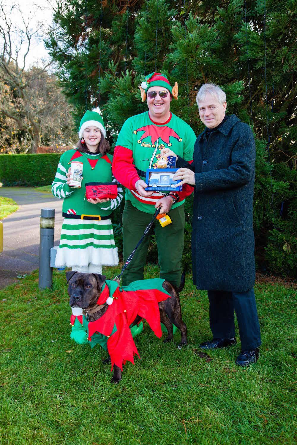 Tamara and Martin Andrews and dog Oscar receive Best Dressed Family and Dog award from Lord Montagu