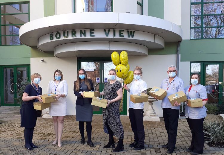 Outside Bourne View with hamper boxes ready to go, are, from left: Julie Steele, Bourne View Customer Support Advisor; Magdalena Zipinska and Olivia Singer from Lester Aldridge Solicitors; Bourne View Home Manager Jenna May; Chef Annabelle Bryer; and Companionship Team members Brian Ramsay and Zoe Rose. 