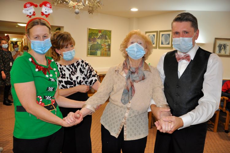 Joan_Whelan_second_from_right_dances_with_left-to-right_Sarah_Moule_the_homes_Companionship_Team_leader_and_Tanya_Hutton_and_Graham_Cooper.JPG