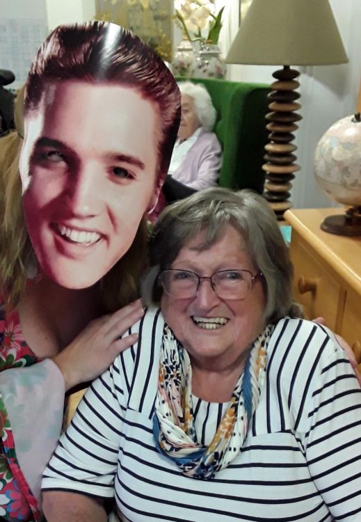 Kingfishers resident Audrey Stokes with, wearing Elvis mask, Companionship Team member Sue Hawkins