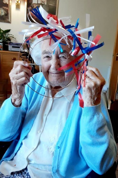 PATRIOTIC. Kingfishers resident Joyce Russell is all smiles as she makes a ribbon wreath for the New Milton home’s Jubilee celebrations