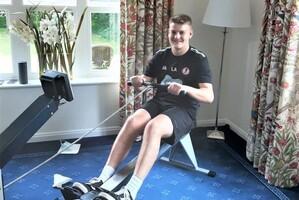 man exercising on machine