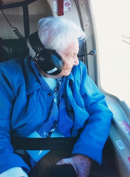 old lady sitting in plane