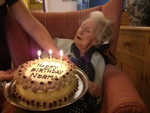Norma enjoys her birthday cake at St Catherines View, September 2015