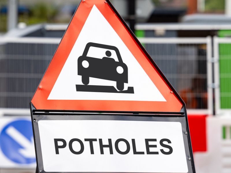 Potholes warning sign