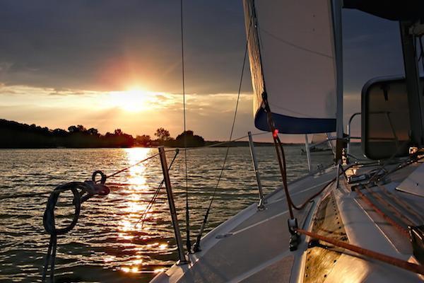 yacht sailing into the sunset