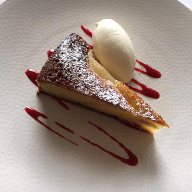 warm pear and almond tart with brandy cream and raspberry sorbet,