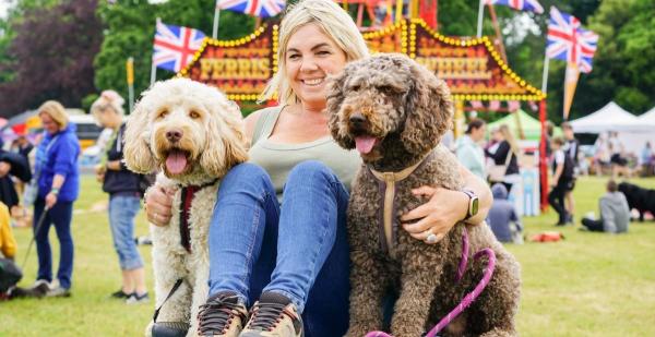 happy owner with happy dogs