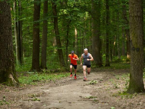 Runners in forest